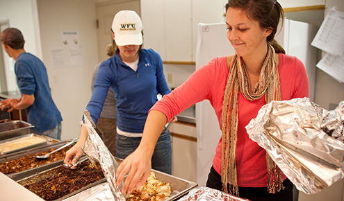 As part of Campus Kitchen's Turkeypalooza, student volunteers deliver dinner to and spend time with young people at The Children's Home in Winston-Salem.