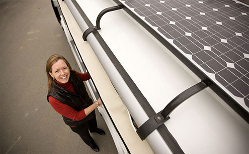 Sustainability director Dedee DeLongpré Johnston, with the newest-model solar-electric hybrid shuttle, now operating on the Reynolda Campus: 