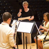 Eileen Young directs the Clarinet Quartet: Andre Nguyen (left to right), Matthew Simari, Jacob Eichhorn and Kayla Shipley.