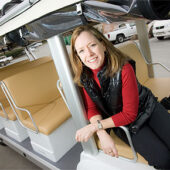 Sustainability director Dedee DeLongpré Johnston with the newest-model solar-electric hybrid shuttle that will begin serving the Reynolda Campus in 2010.