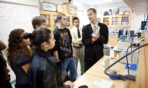 Professor Jed Macosko gives a tour of his lab in Olin Physical Laboratory to students from Atkins Academic and Technology High School.