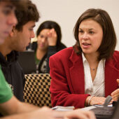 Sociology’s Rebecca Matteo works with students in her first-year seminar on health-care reform.