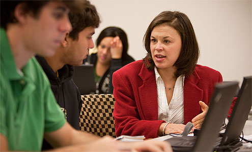 Sociology’s Rebecca Matteo works with students in her first-year seminar on health-care reform.