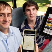 Seniors Michael Crouse, left, and Tom Loughran ride the Wake Line shuttle bus as they display their new iPhone and iPad application that tracks the shuttle in real time using GPS technology.