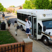 Wake Forest students ride one of the new campus shuttle buses.