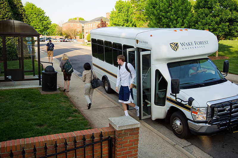 Wake Forest students ride one of the new campus shuttle buses.