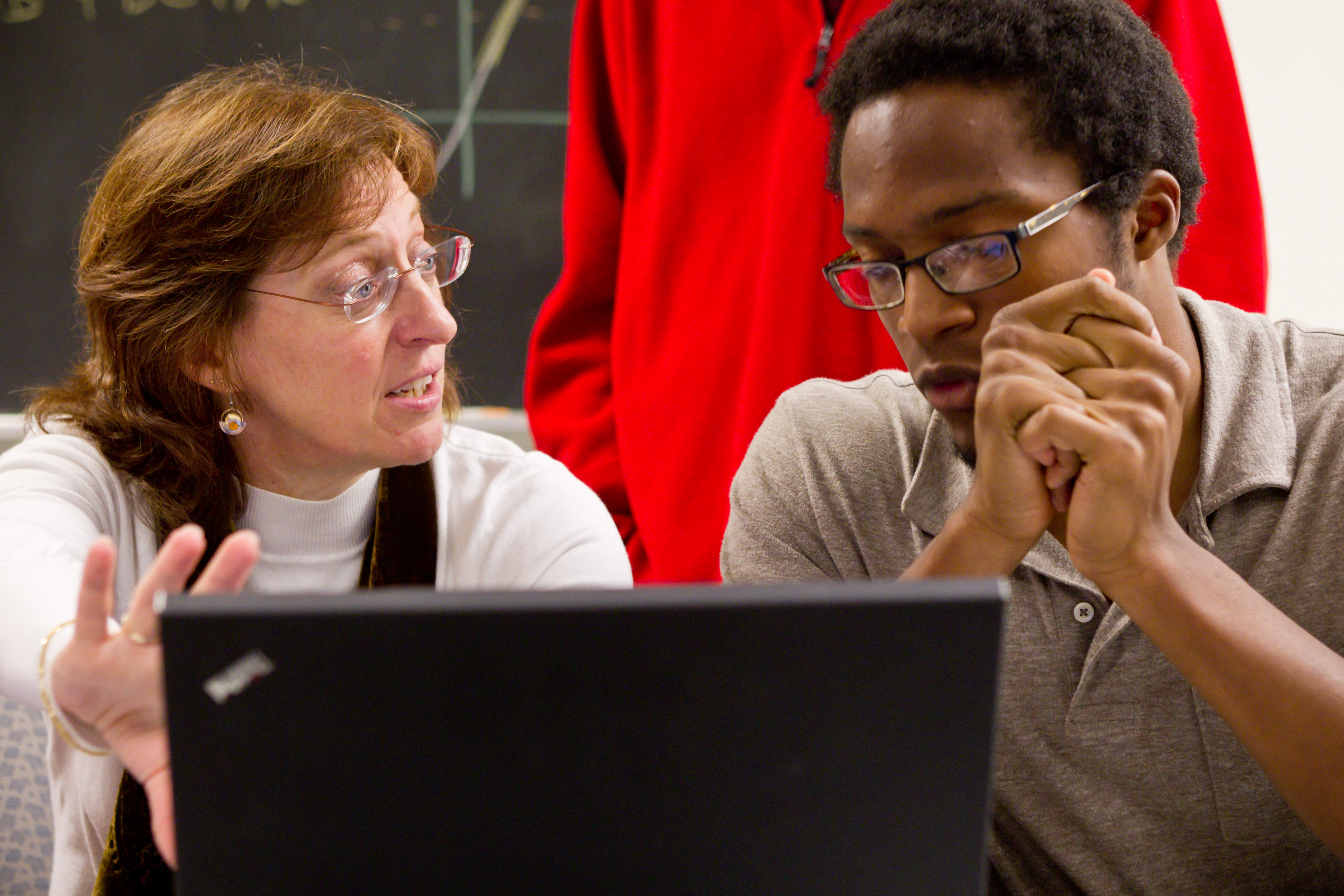 Junior Brandon Turner talks about a research project with his mentor Reynolds Professor of Computational Biophysics Jacque Fetrow, who is also dean of the college.