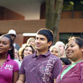 Sophomore Mojeeb Nazeri (center) attends a rally during the Interfaith Youth Corps Leadership Institute..