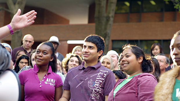 Sophomore Mojeeb Nazeri (center) attends a rally during the Interfaith Youth Corps Leadership Institute..