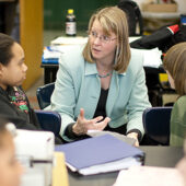 Gloria Muday talks with students