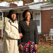 Law student Ashleigh Wilson ('11), right, stands with homeowner Tonya Williams.