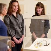 Bernadine Barnes and students in art gallery.