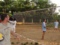 Students play soccer with locals in Vietnam village.