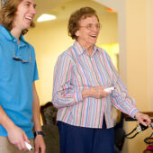 Sophomore Michael Scott competes against resident Joan Stewart in Wii Bowling at Independence Village, a retirement community in Winston-Salem.