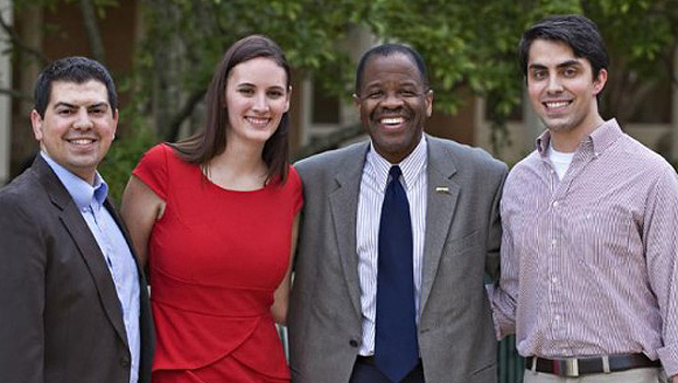 Alexandra Ford (’12), Michael Grippaldi (’11), and Craig Principe (’12) pose with Dean Blake Morant