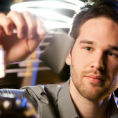 Graduate student Corey Hewitt works with a sample of thermoelectric fabric in the Nanotechnology lab.