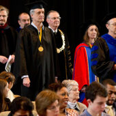 History professor Michael Hughes leads the processional.