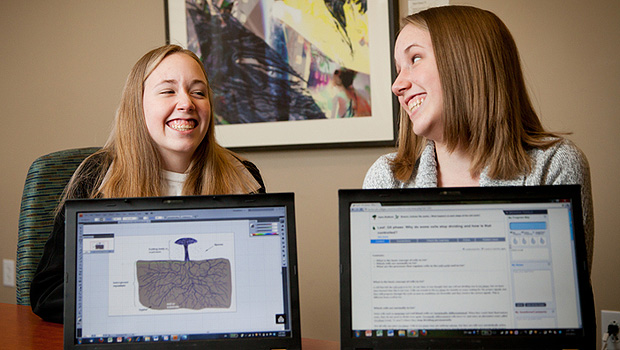 Sophomores Tiffany and Jessica Blackburn share laughs and the BioBook student workload.