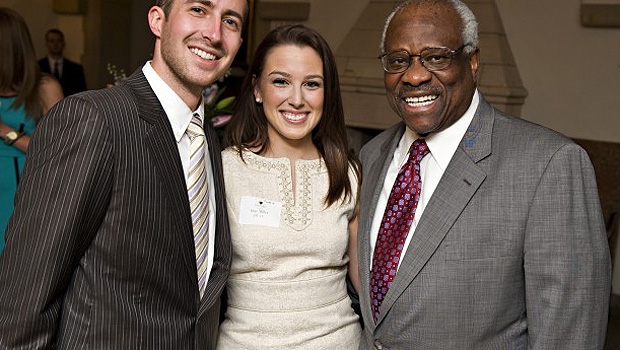Marc Rigsby ('13) and Shay Miller ('13) pose with U.S. Supreme Court Justice Clarence Thomas.