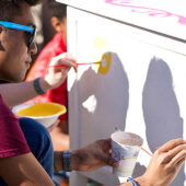 Student painting a desk