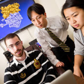 Professor Samuel Cho with students Tyson Lipscomb and Anqi Zou