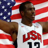 Chris Paul holds the American flag. (Associated Press)