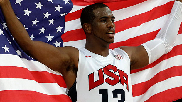 Chris Paul holds the American flag. (Associated Press)