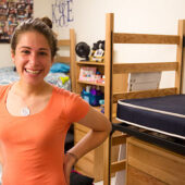 Leslie Huffman poses in her new room.