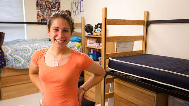 Leslie Huffman poses in her new room.