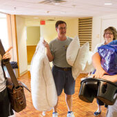 Senior resident adviser Ethan Groce (right) helps Brad Keck ('13) and his parents, Tom and Becky, with the move into Polo Residence Hall.