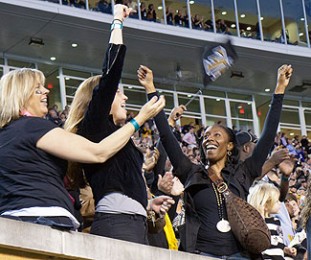 Fans cheer at a Wake Forest football game.