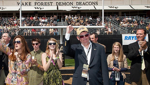 Ben Sutton Jr. and his family acknowledge the crowd after the gift was announced during the Wake Forest-Army football game.