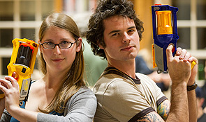 Two students hold their Nerf guns