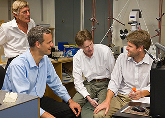 From left: NanoMedica CEO Roger Cubicciotti and Wake Forest physics professors Jed Macosko, Keith Bonin and Martin Guthold in a lab in Olin Hall.