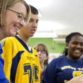 Gloria Muday works with local students.