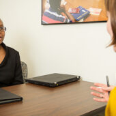 News director Katie Neal ('03) interviews senior philosophy major Marika Dillard ('13).