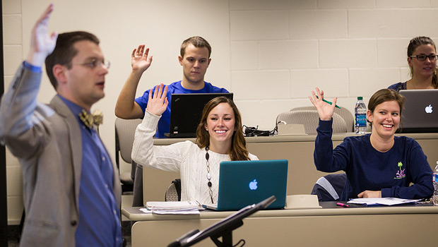 Accountancy graduate student Tori Stewart (front left, '12, MSA '13) interacts in her business ethics class taught by professor Matthew Phillips.