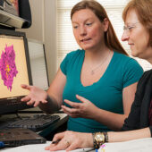 Graduate student Janelle Leuthaeuser (left) and Jacque Fetrow, Reynolds Professor of Computational Biophysics and Dean of the College, talk about their research.