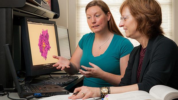 Graduate student Janelle Leuthaeuser (left) and Jacque Fetrow, Reynolds Professor of Computational Biophysics and Dean of the College, talk about their research.