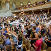 Students throwing paper airplanes in Wait Chapel