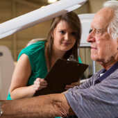 Lindsay Tise, 94, does strength-training exercises under the supervision of Sarah Commander ('14).