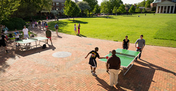 Students play ping-pong on the Quad.