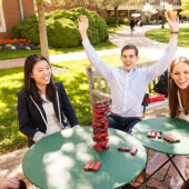 Students play Jenga on the Quad