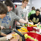 Brittany Forniotis (’15), left, works in the Campus Kitchen.