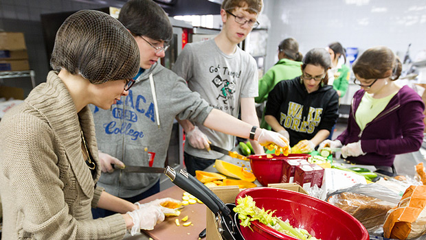 Brittany Forniotis (’15), left, works in the Campus Kitchen.