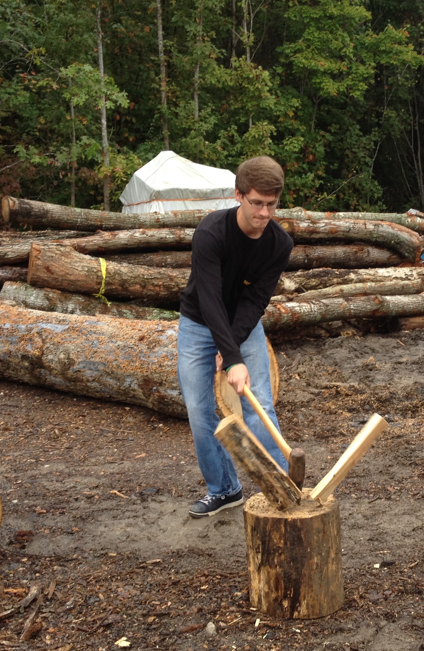 Belangia chopping firewood for Wake for Warmth.