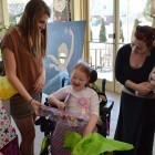 Pocahontas (Wake Forest student Lydia Pappas) talks with Ava Elsner and her mother at the Make-A-Wish event on campus. Photo credit: Cameron Miller.
