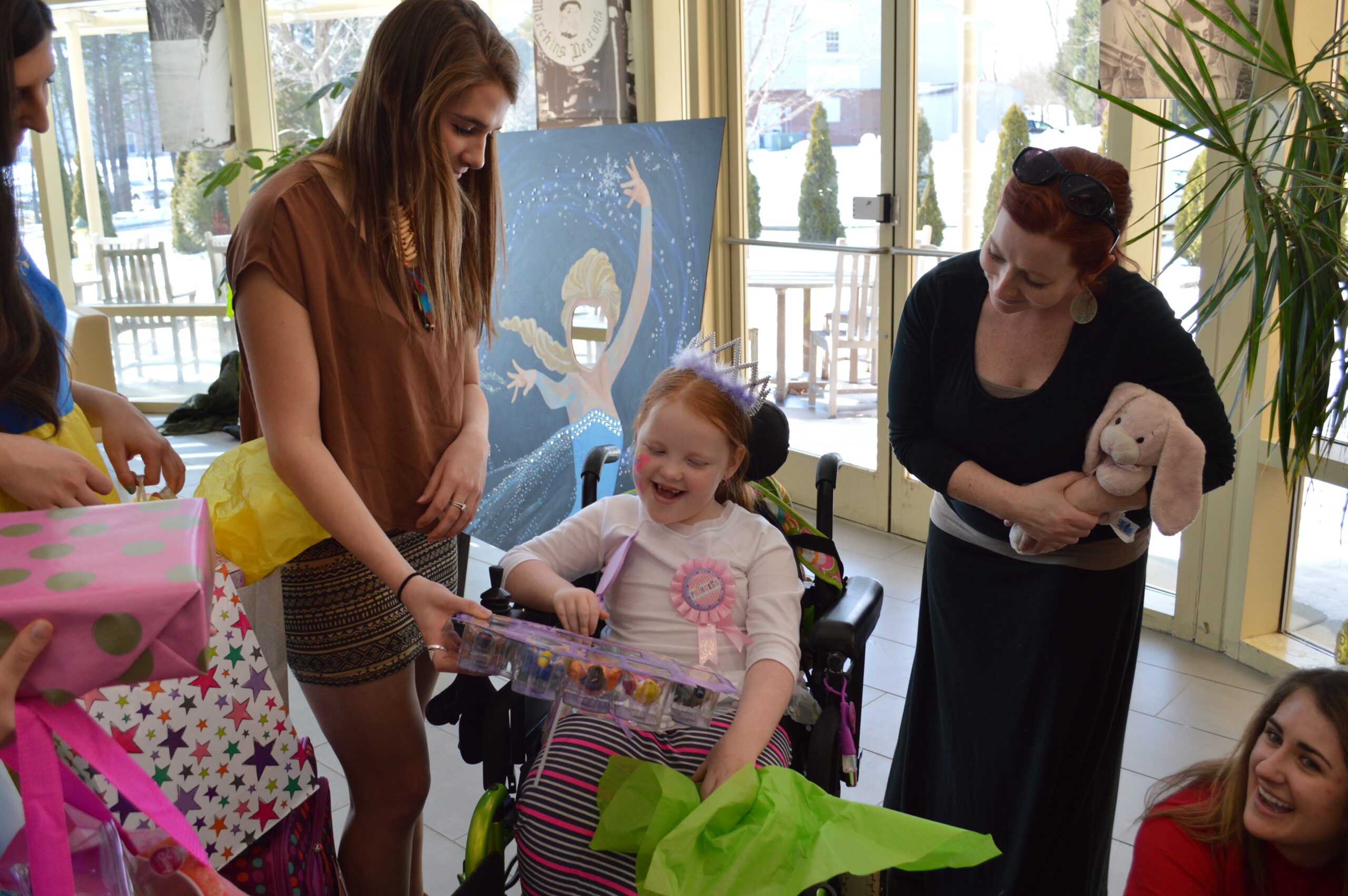 Pocahontas (Wake Forest student Lydia Pappas) talks with Ava Elsner and her mother at the Make-A-Wish event on campus. Photo credit: Cameron Miller.