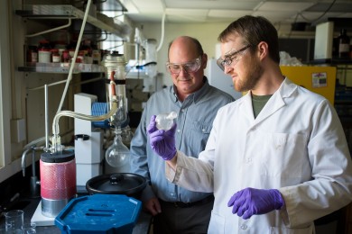 Wake Forest chemistry graduate student Thomas Poole and professor Bruce King talk about their research in a lab in Salem Hall