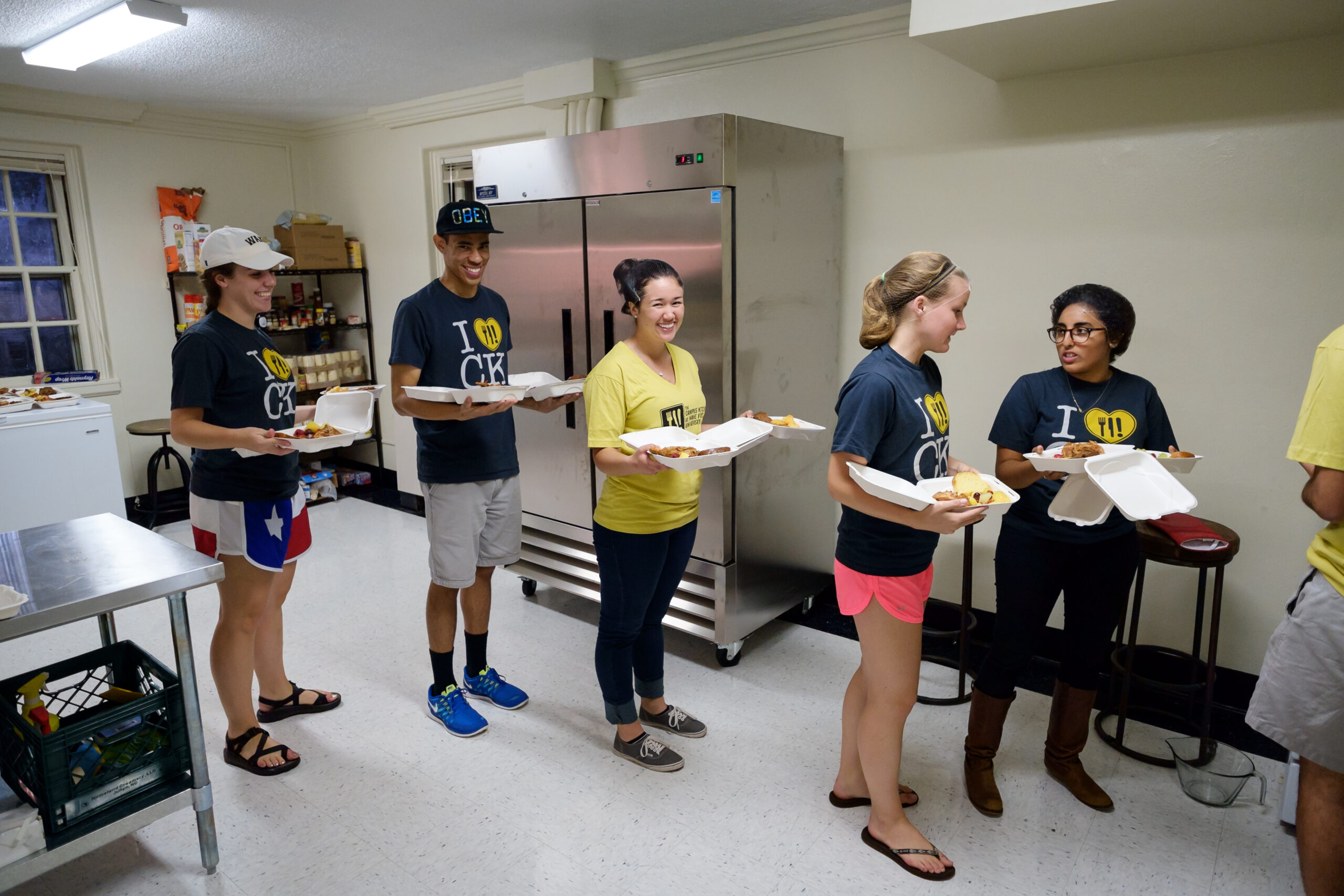 Campus Kitchen executive board members and volunteers prepare meals for local residents in its new space in Kitchin Residence Hall.